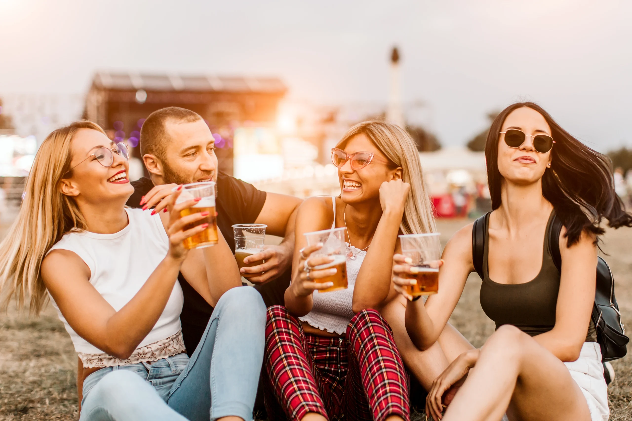 Group of young people having fun at the music festival